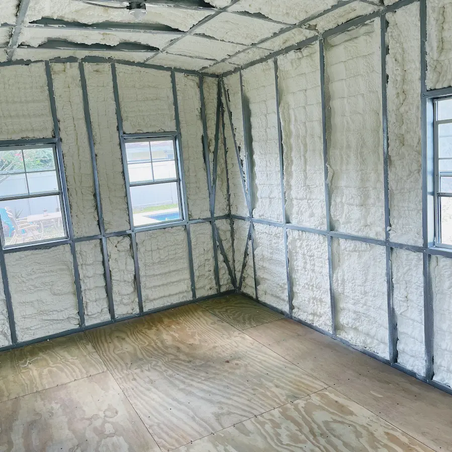 Closed-cell spray foam insulation applied to wall cavities in a residential project in Brewer